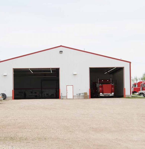 Large white garage with doors open